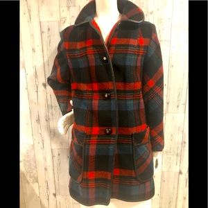 Vintage plaid coat with leather trim.